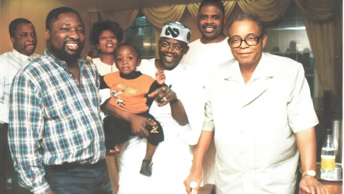 Bola-Tinubu-carrying-Tokunbo-Jnr-at-a-NADECO-meeting-in-London